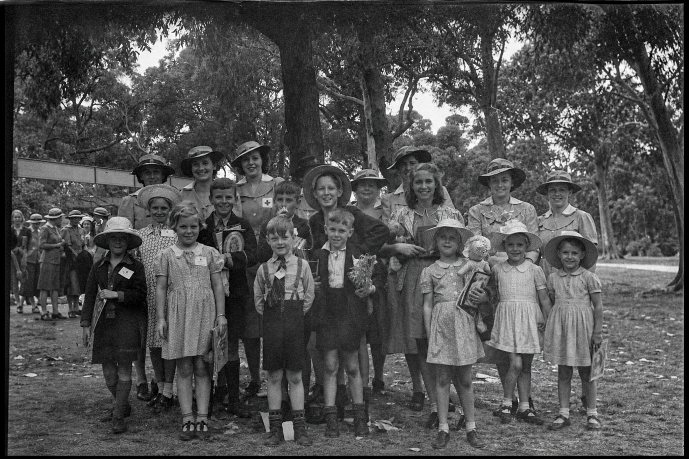 The same photograph with the burned side filled in by children and women who were never in it