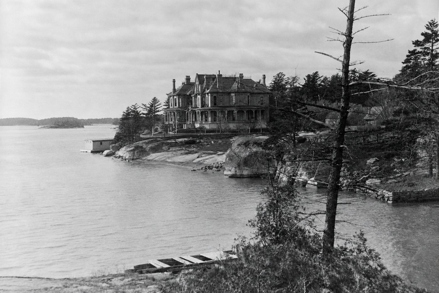 The same view returned whole, the lost area filled with roofline, trees and shore the repair supplied