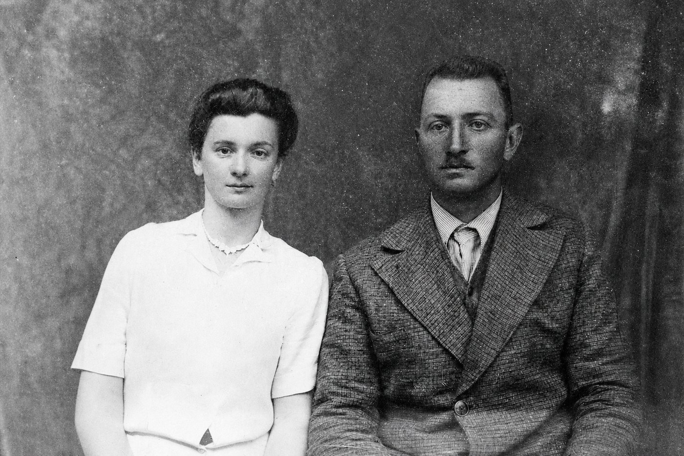 The same couple with the surface smooth again, both faces redrawn by the repair